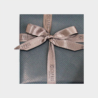 包装紙：ネイビー　リボン：ブラウン